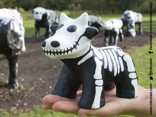 Special edition Mini Concrete Cow painted to look like a skeleton and sold on eBay.